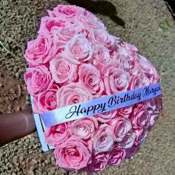 Mini hat box with fresh flowers and a customized birthday ribbon