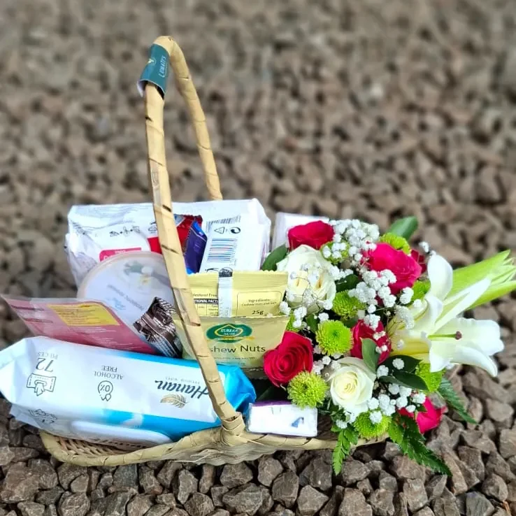 Period care package with sanitary pads chocolate wipes snacks and wellness items